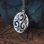 Triskel pendant in a circle, adorned with triquetra and small crystals, celtic and irish jewelry