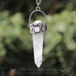 Pendant with large quartz point and natural rainbow moonstone