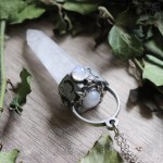 Pendant with large quartz point and natural rainbow moonstone