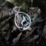 Wolf pendant surrounded by an ouroboros and a stone, pagan jewelry