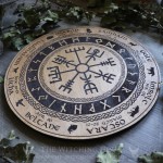 Pagan wheel of the year with viking vegvisir and names of the witches sabbaths
