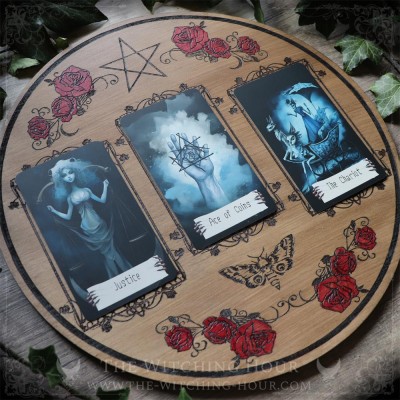 Wooden divination board decorated with red roses and a pentacle, for three-card tarot or oracle readings.