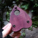 Red wooden ouija planchette with ravens, gothic home decor or cabinet of curiosities