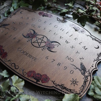 Wooden ouija board adorned with a pentagram in a triple moon, talking board and planchette, for spiritualism and divination