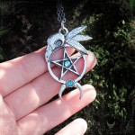 Gothic pentagram necklace with raven skull and moon crescent, adorned with blue apatite