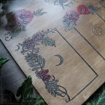 Nature inspired tarot and oracle spread board with a bumblebee, poppies and flowers