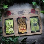 Nature inspired tarot and oracle spread board with a bumblebee, poppies and flowers