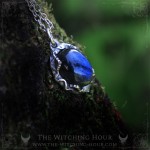 Blue labradorite necklace surrounded by leaves, nature inspired handmade jewelry