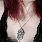 Gothic cathedral necklace surrounded by two gargoyles amd ivy leaves, vampire goth jewelry