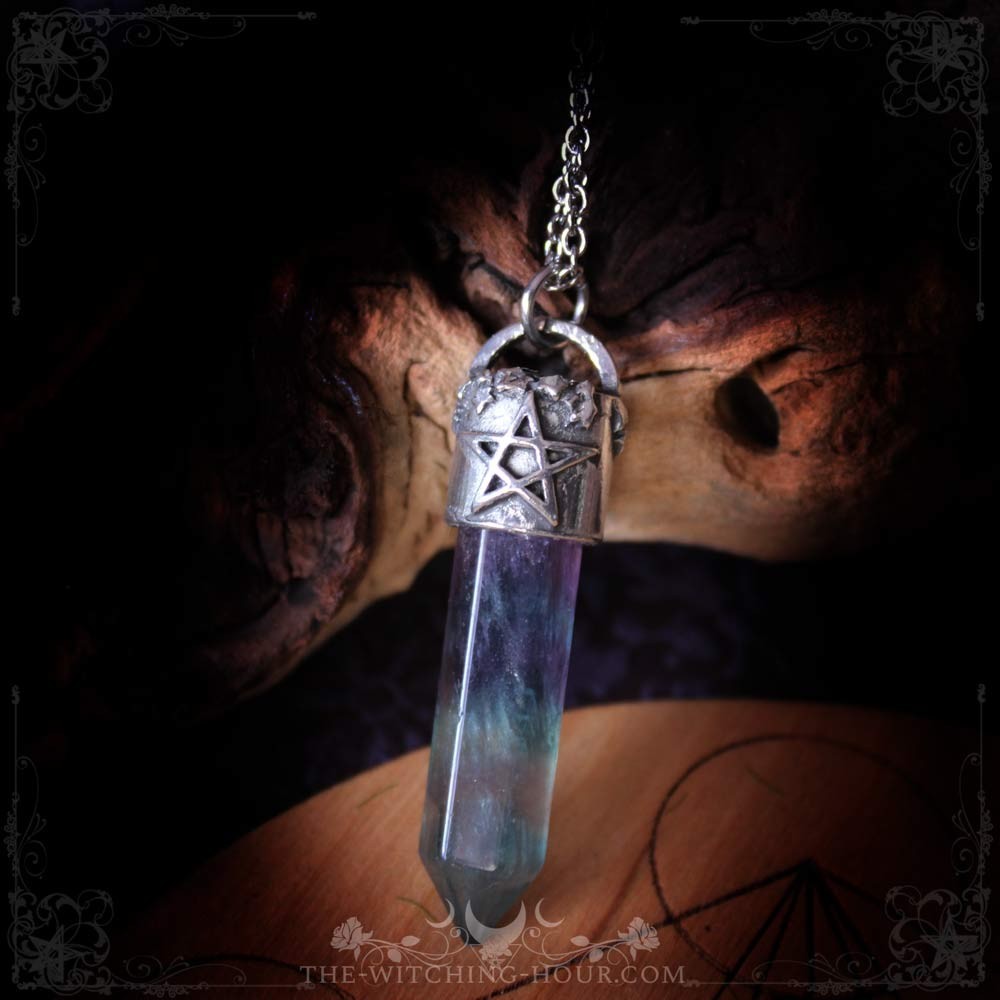 Fluorite point pendant with pentagram support