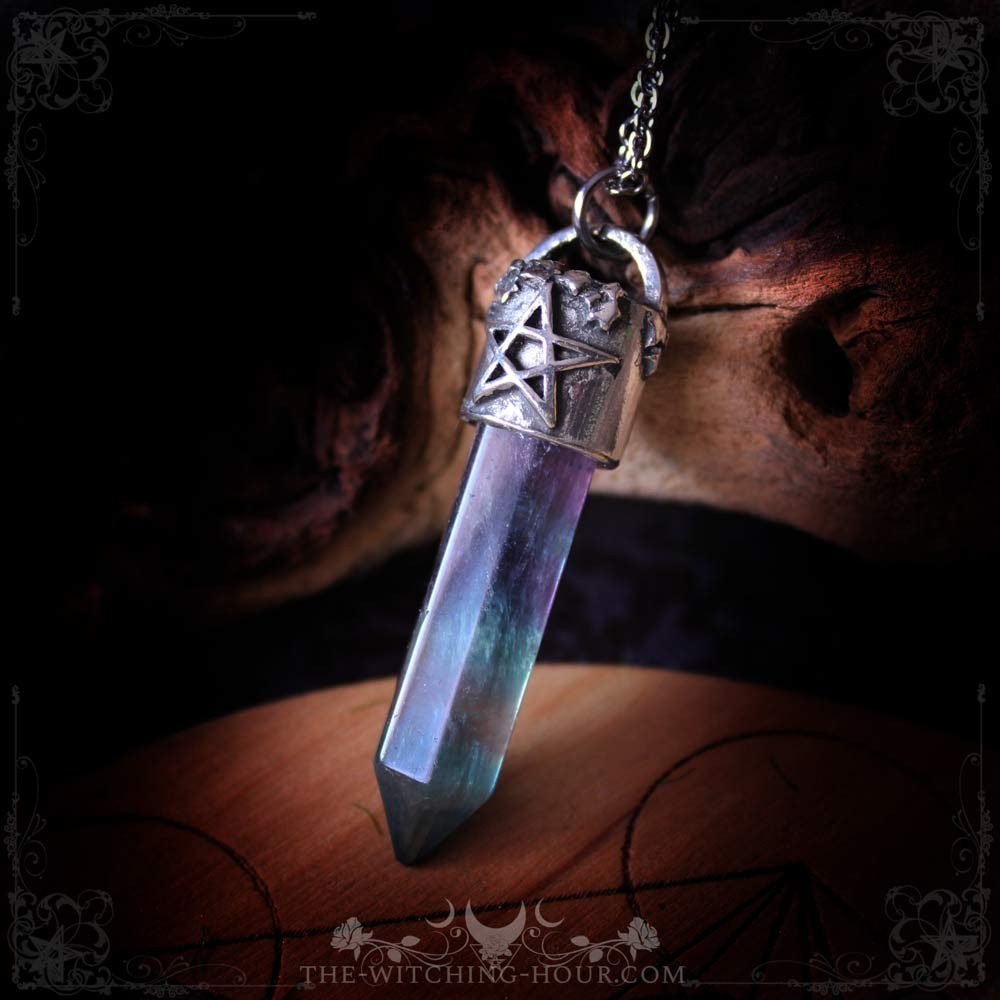 Fluorite point pendant with pentagram support Fluorite point pendant with pentagram support
