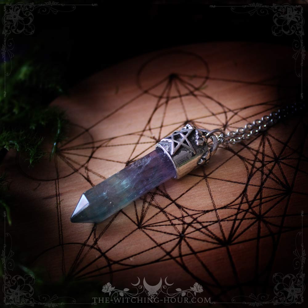 Fluorite point pendant with pentagram support