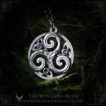 Triskel pendant in a circle, adorned with triquetra and small crystals, celtic and irish jewelry