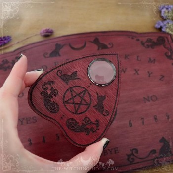 Red wooden ouija board with cats