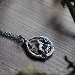 Wolf pendant surrounded by an ouroboros and a stone, pagan jewelry
