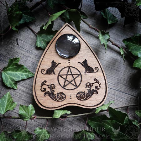 Ouija planchette with cats and a pentagram