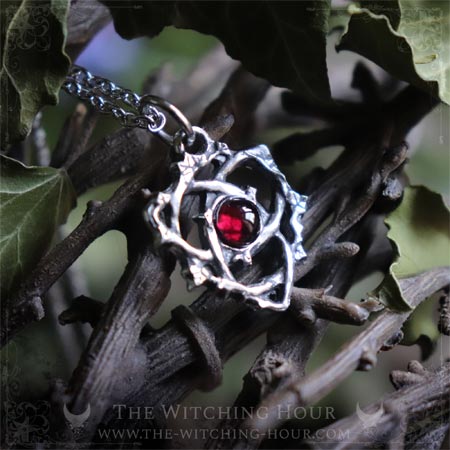 Triquetra pendant with red garnet