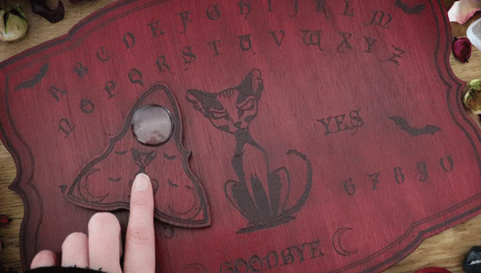 Red ouija board with cat